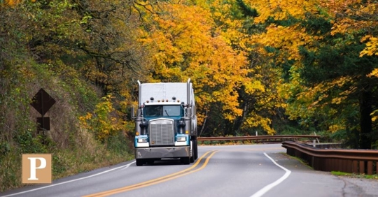 truck driving during autumn